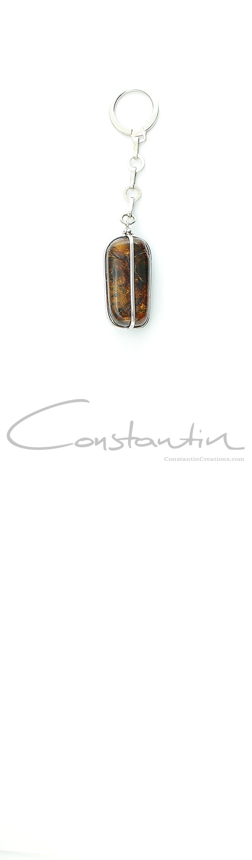 Unique, Hand Made Key holder made of natural Dominican Amber and Rhodium plated sterling silver.