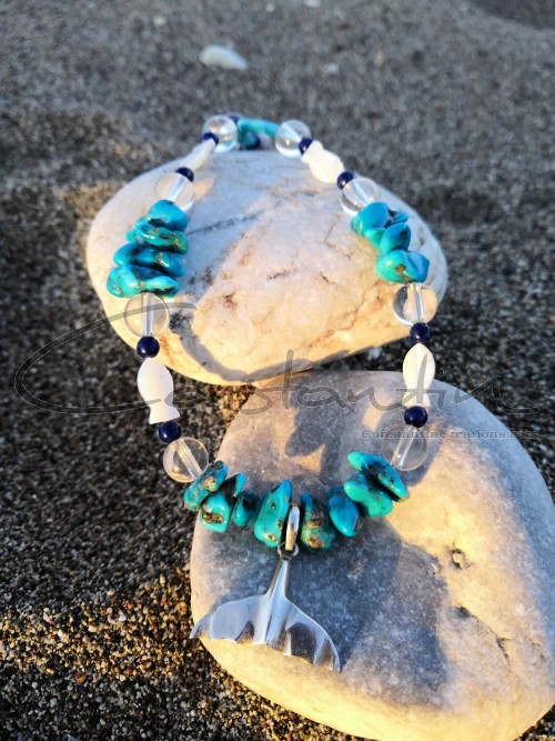 In the center of necklace is hanging a handmade sterling silver pendant of mermaid tail !