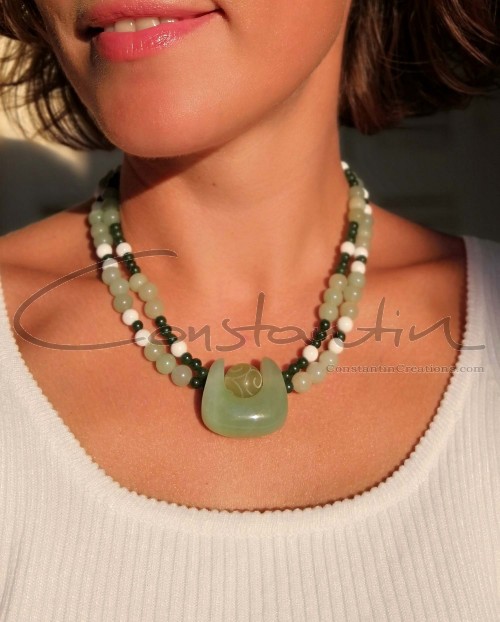 Free style design, double strand necklace with characteristic stone pendant.
