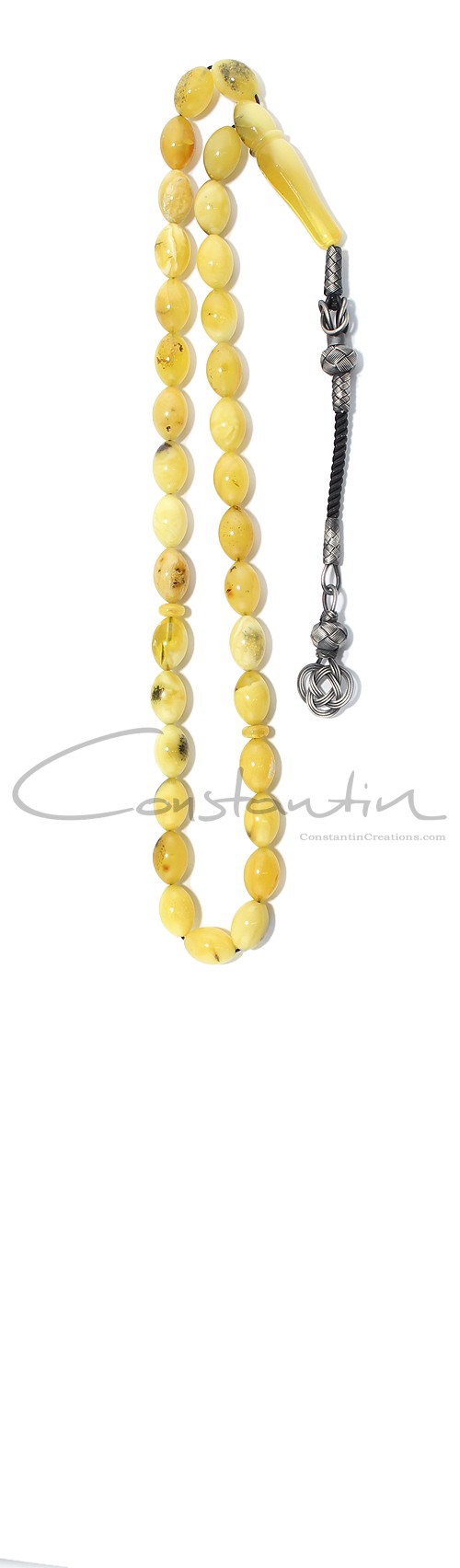 Yellow natural amber worry beads in traditional style.