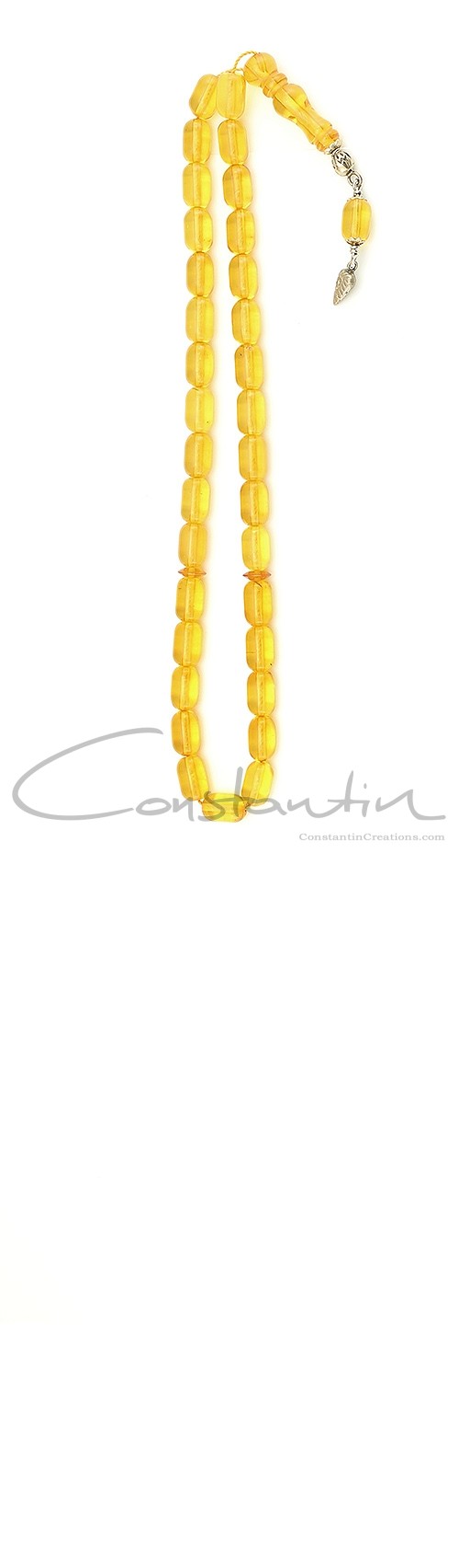 Selected transparent, natural yellow amber worry beads decorated with silver.