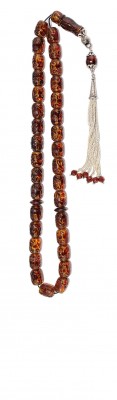 Unique hand engraved natural amber worry beads.