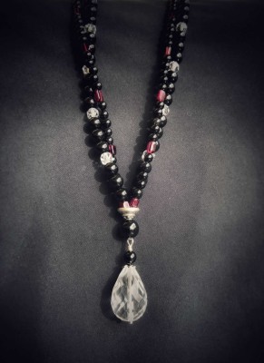Tear drop shape, Rock crystal pendant, on handcrafted beaded necklace.