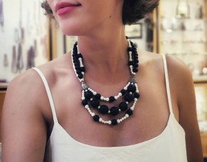 Black & White, hand crafted necklace, made of lava stone and white coral beads of various sizes.
