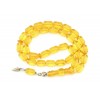 A complete set with 33 barrel shape, selected natural amber beads, head piece and separators.