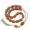 Originally, very light Yellow and transparent amber is selected for this item. The Dark finished amber beads surface is by traditional burning technique.