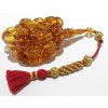 Hand woven traditional tassel with amber bead