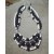 Black & White, hand crafted necklace, made of lava stone and white coral beads of various sizes.