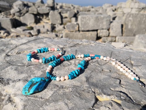 Various sizes and shapes of gemstones and corals in a colorful and stylish combination.