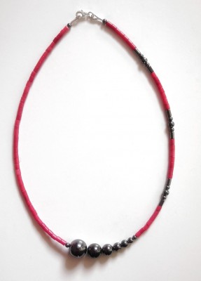 Handcrafted necklace with special character, made of genuine coral and hematite gemstone beads. 