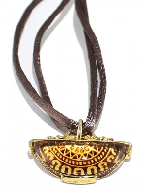 Natural back engraved amber pendant.