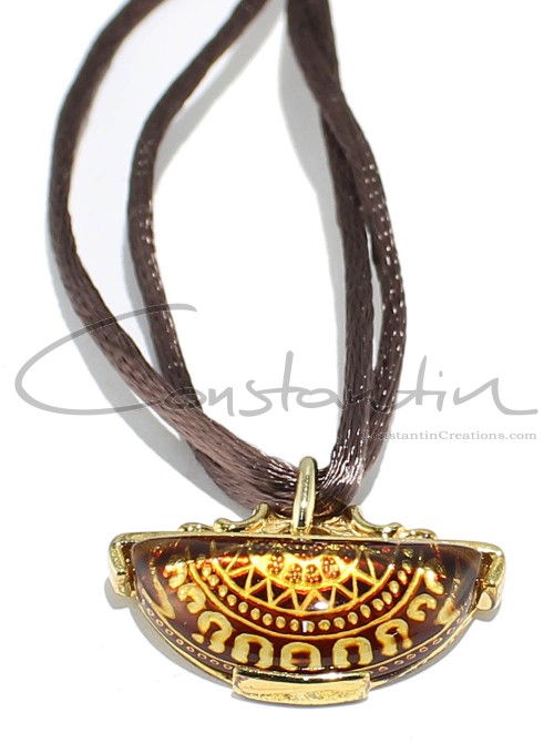 Natural back engraved amber pendant.