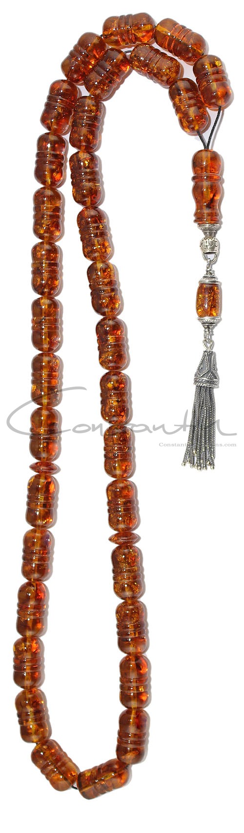 Classic style, Long natural amber worry beads with engraved details.