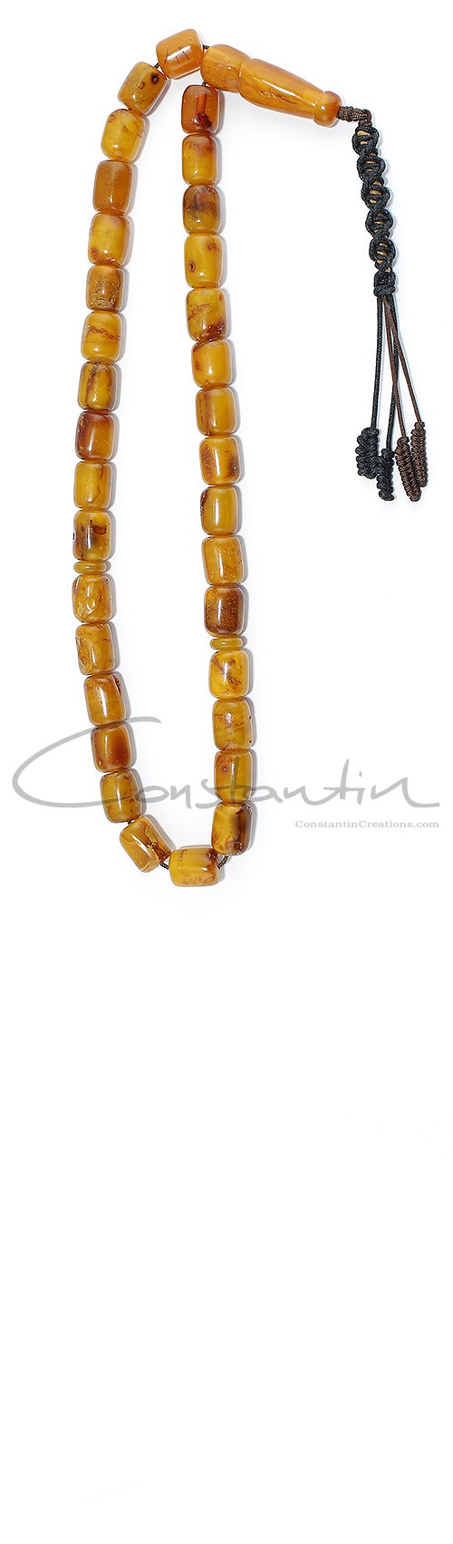 Worry beads set, made of dark Yellow natural amber, with darker and lighter shades of Brown.