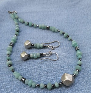 Handmade necklace & matching earrings made of natural faceted Aquamarine and hematite stone beads, with silver parts. 