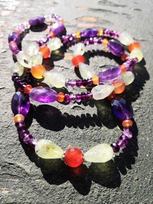 Multicolor combination of Amethyst, Prehnite, Flourite and Carnelian beads on a long necklace.