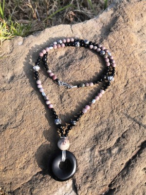 Long, free style necklace, with disk shaped Black Onyx center bead. 