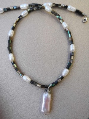 Casual necklace of sea shell beads and natural pearls.