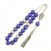 Aditional stone bead is decorating the custom, hand made tassel.