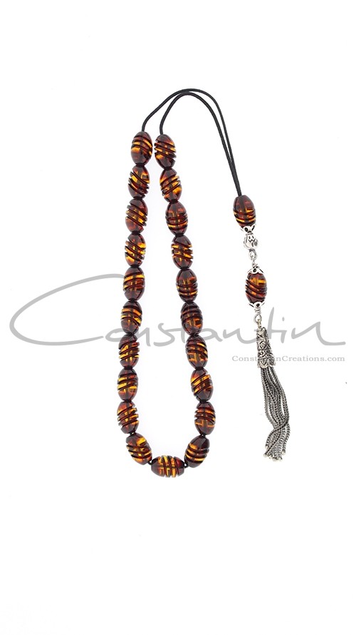 Greek komboloi of engraved amber beads and silver parts.