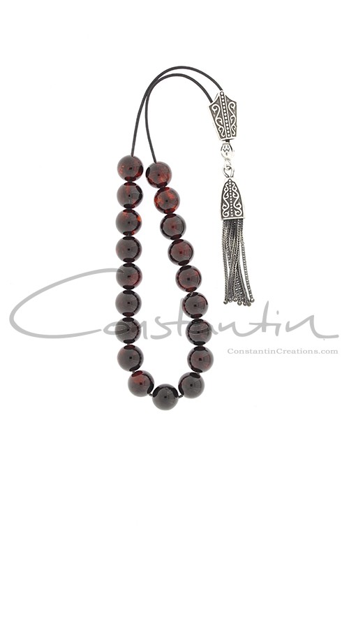 Classic, handy size , Greek Amber komboloi with silver decoration.