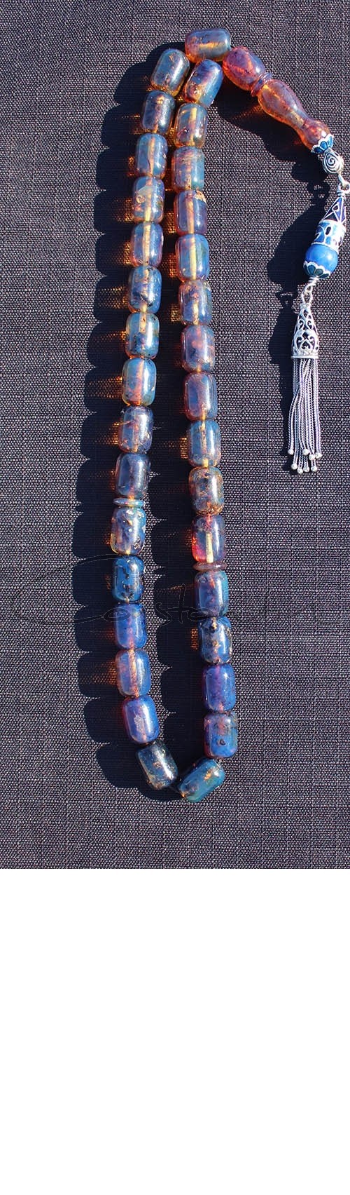 Extraordinary, hand crafted worry beads set made of   Dark Blue, Natural Dominican amber.