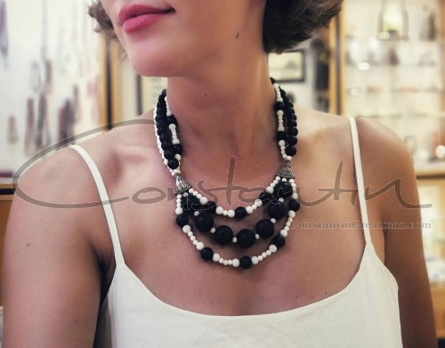 Black & White, hand crafted necklace, made of lava stone and white coral beads of various sizes.