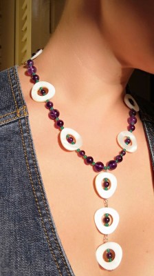 Long hand crafted necklace of Amethyst, mother of pearl and green agate stones.