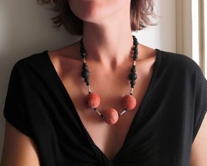 Casual necklace made of large round sponge corral beads , lava stone, black Onyx and antique finished silver parts. 