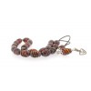 Antique finished, hand crafted, sterling silver 925º parts and custom made tassel, decorated with additional amber bead.