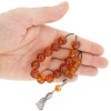 Traditional, vintage look, hand made silver tassel decorated with amber bead.